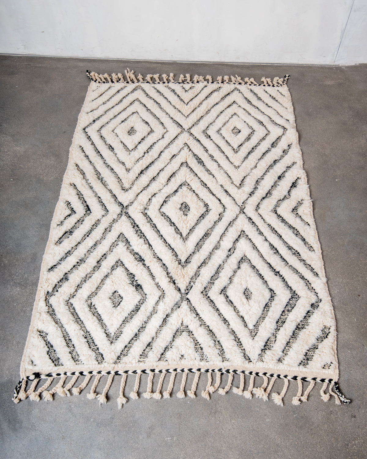 Modern, designer, handcrafted Berber rug from Morocco. Beniourain carpet with minimalist design, natural wool pile and a fluffy texture.